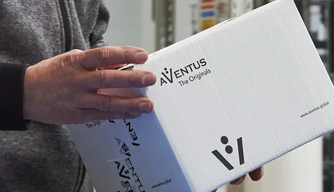Box of AVENTUS origital parts in the hands of a service technician