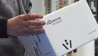 Box of AVENTUS origital parts in the hands of a service technician