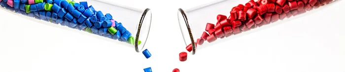 Two test tubes full of plastic granules standing for Polymer Alliance