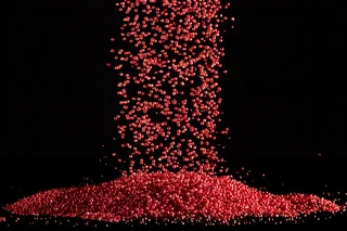 Free flowing red plastic granules