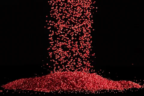Free flowing red plastic granules